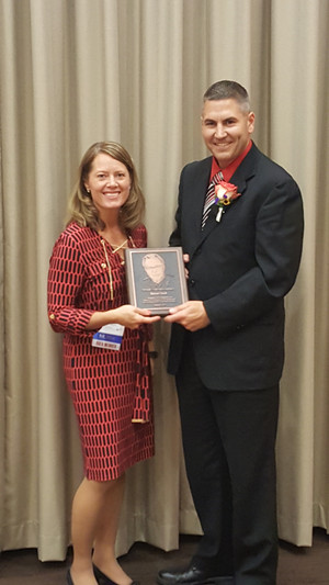 Stephanie Jansen, 2016 Russell J. Hosler Award recipient, presenting the 2017 award to Mr. Doell.